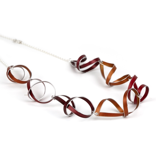 Red, orange and burgundy seven ribbon loop necklace - side view