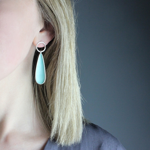 Turquoise concave teardrop earrings - worn