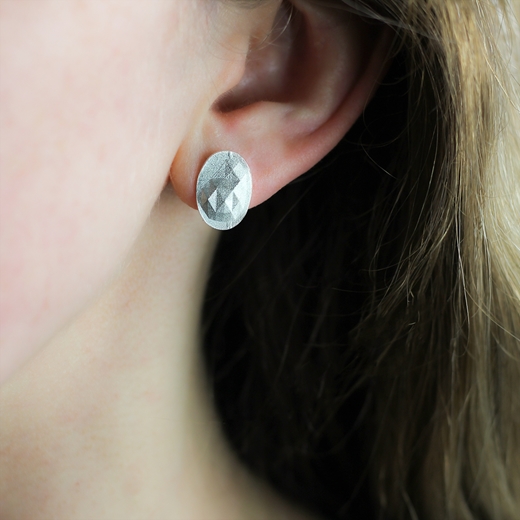 Faceted oval earrings - 15 strikes worn
