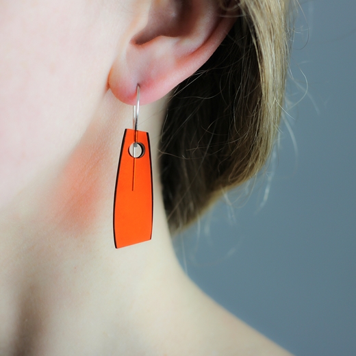 Figure 1 Orange earrings worn