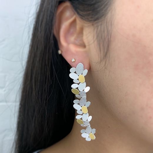 Mixed ovals flower chain earrings worn
