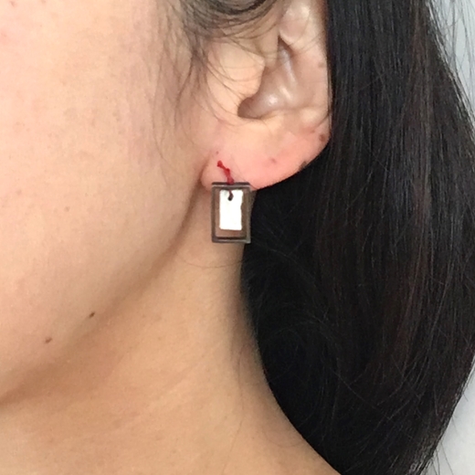 Omikuji earring worn