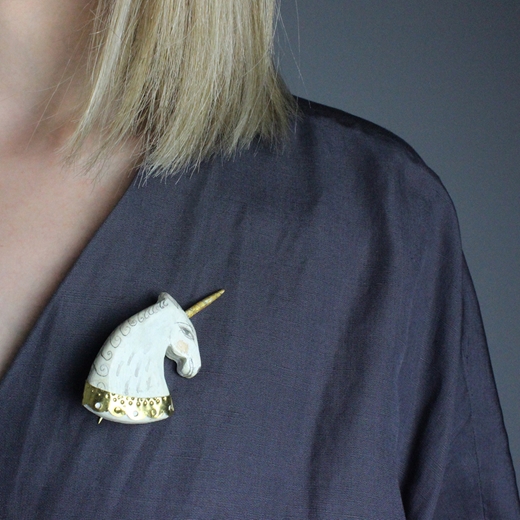 White unicorn brooch - worn