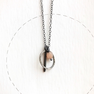 Loop tag and stone pendant