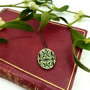 Worn Away Green and Black Book Cover Pendant Front