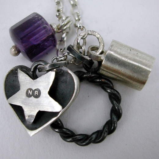 Heart on heart pendant with amethyst, back view