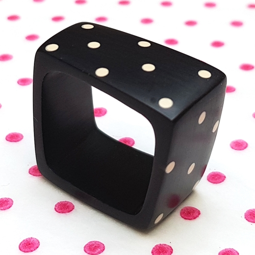 Black square ring with nude spotty design