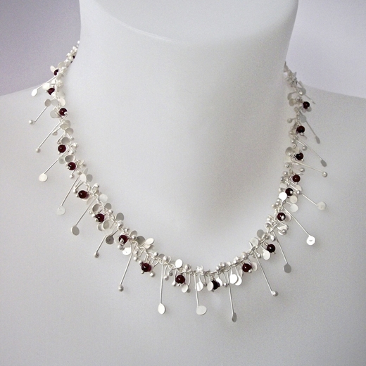 Blossom wire necklace with garnet, satin by Fiona DeMarco