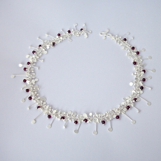 Blossom wire necklace with garnet, satin by Fiona DeMarco