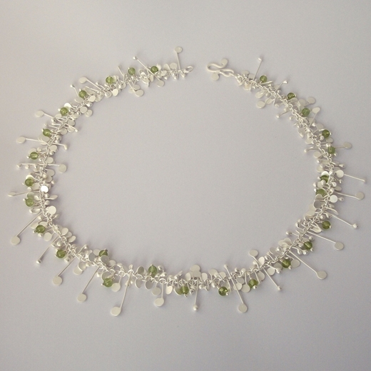 Blossom wire necklace with peridot, satin by Fiona DeMarco