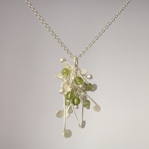 Blossom wire cluster pendant with peridot, satin by Fiona DeMarco