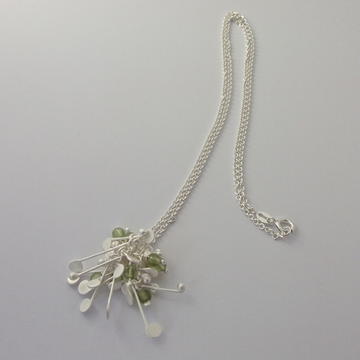 Blossom wire cluster pendant with peridot, satin by Fiona DeMarco