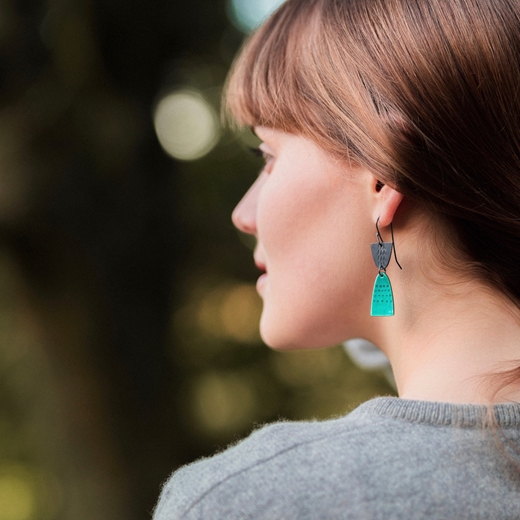Leonora earrings on model, left
