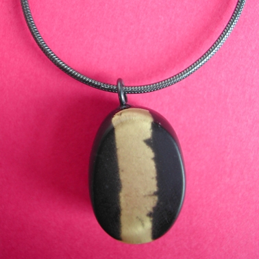 black and gold leaf oval pendant