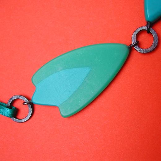 turquoise and green resin and ribbon necklace detail