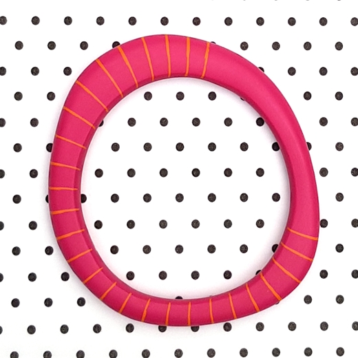 pink resin bangle with orange stripe pattern inlayed