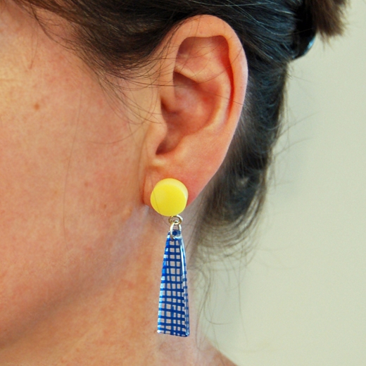 blue with yellow stud top weave earrings on model