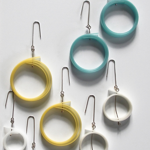 Group featuring large yellow earrings