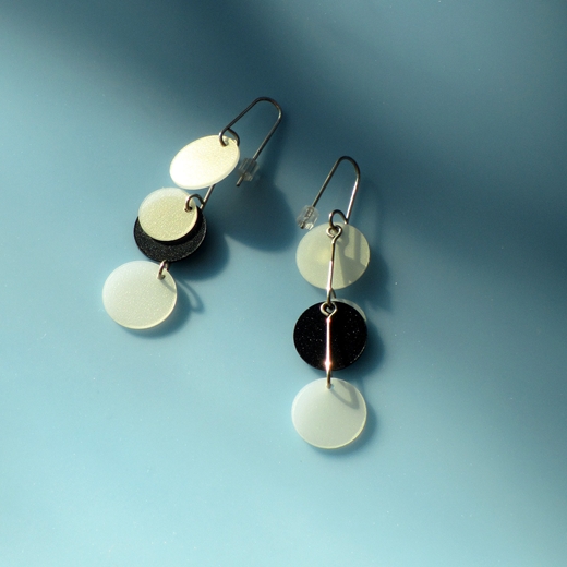 cream and black earrings front and back