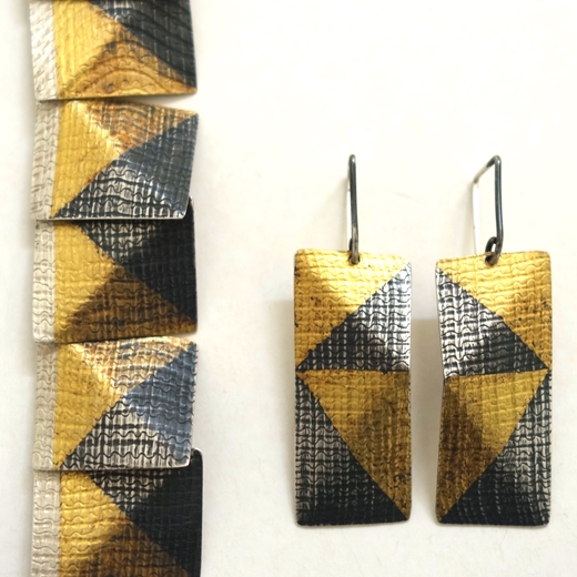 Earrings with necklace detail