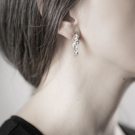 Ra earrings on ear (silver)