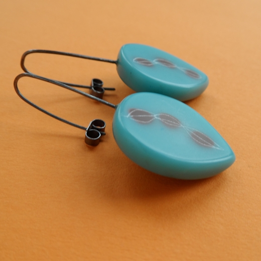 turquoise resin drop earrings side view