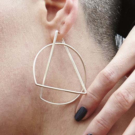 Large hoop earrings modelled