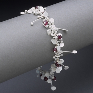Blossom wire bracelet with garnet, satin