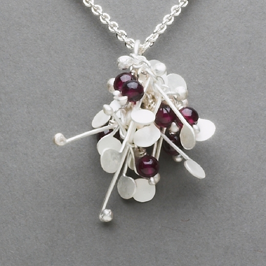 Blossom wire cluster pendant with garnet, satin