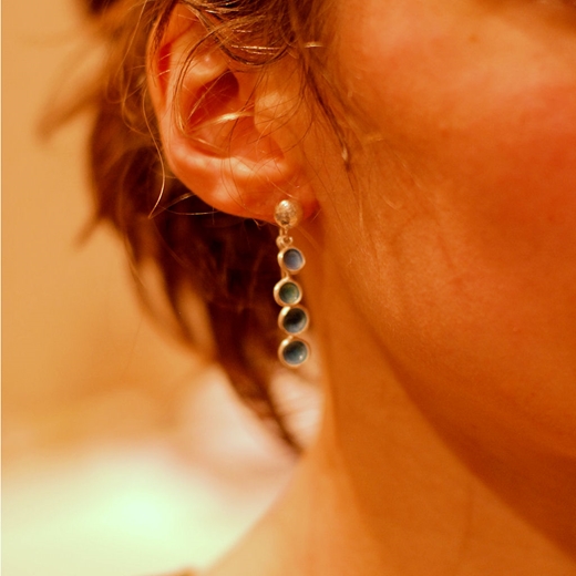 Flourish droplet earring worn