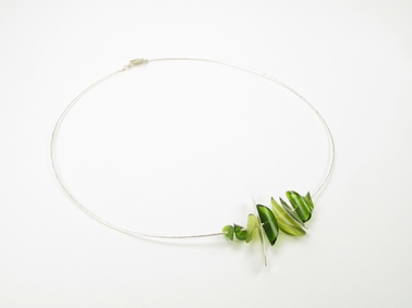 green fragments on cable necklace