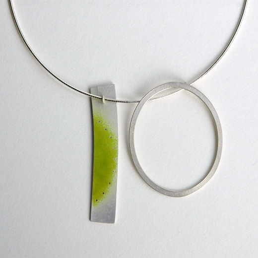 Part green rectangle and silver loop on an omega chain