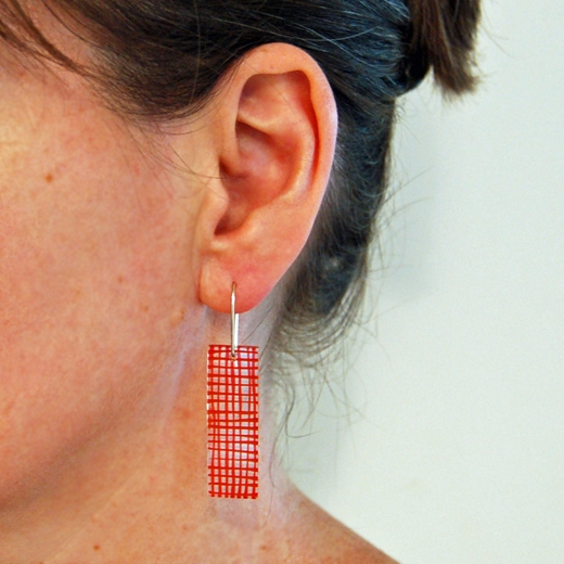 orange grid earrings worn