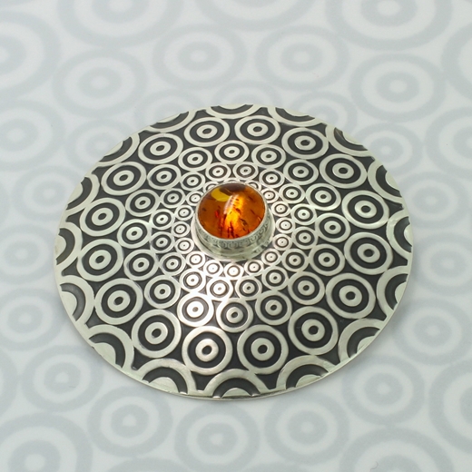 Circle pattern brooch, amber