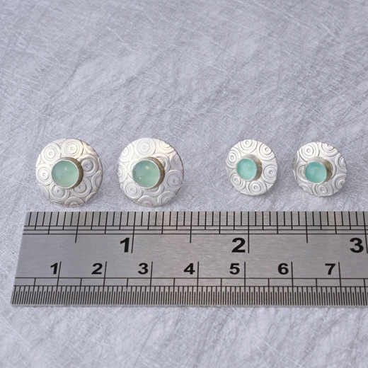 Satin silver ear studs, ruler, small and large studs