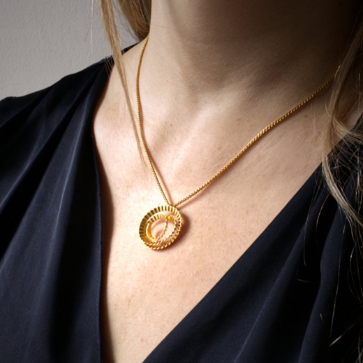 Spiral pendant - gold - model photoby Clara Breen