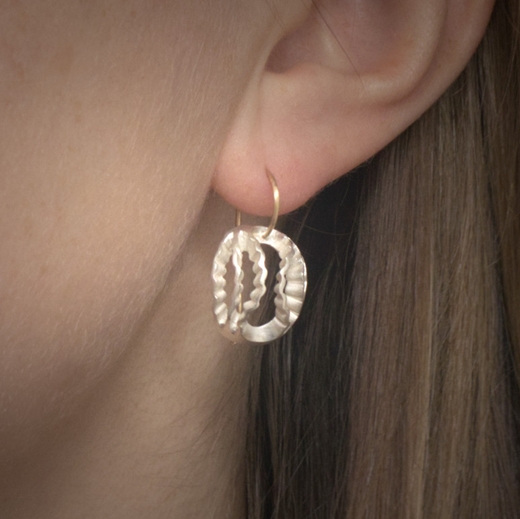 Dainty Strata earrings- Silver and gold version of this design being worn