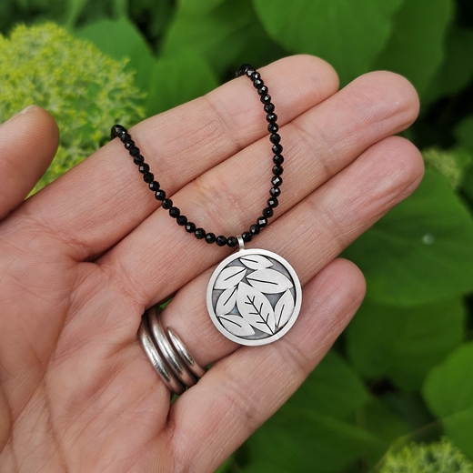 leafy silver necklace with spinels