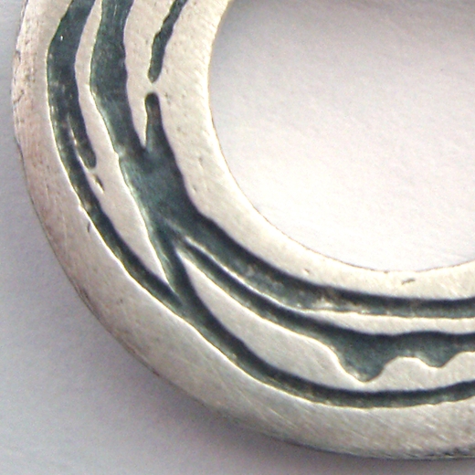 Spiral etched silver pendant - detail