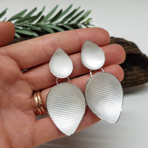 large pyrus drop earrings in hand