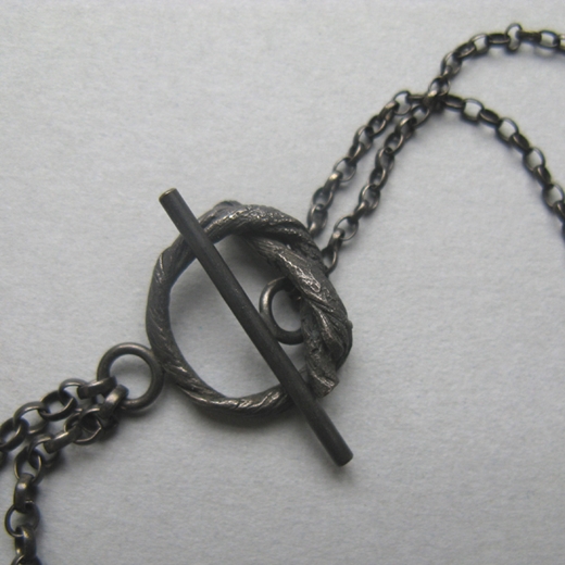 long string neckpiece on oxidised chain