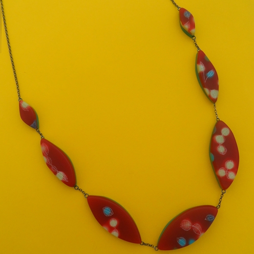red patterned leaf necklace