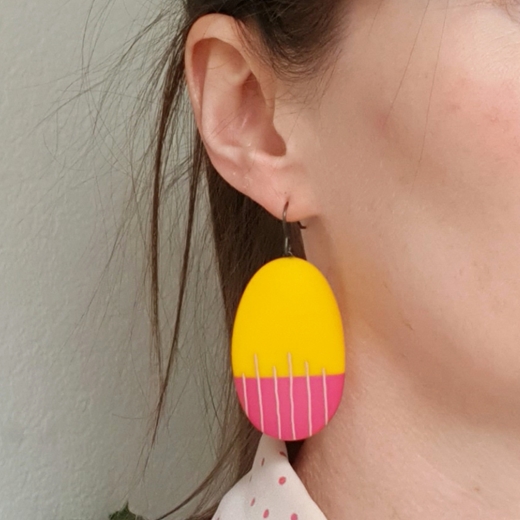 yellow drop earrings worn