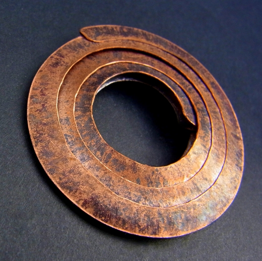 Small copper circle brooch
