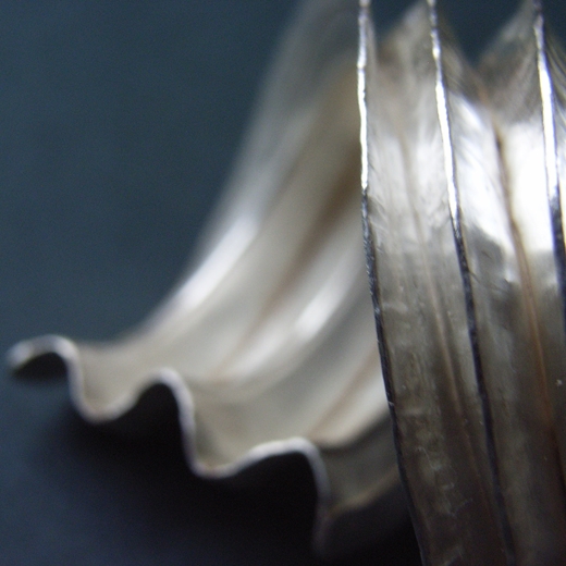 Five fold silver curve pendant detail