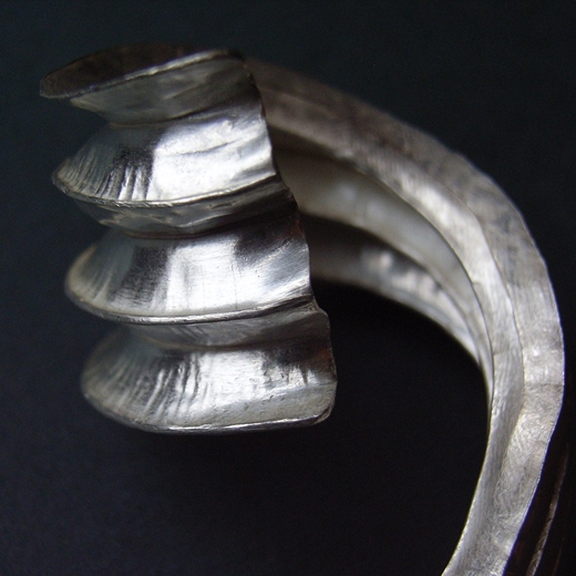 Five fold silver curve pendant detail