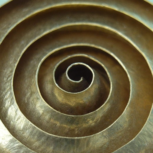Detail spiral brass brooch