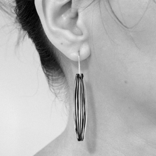 seed earrings on model