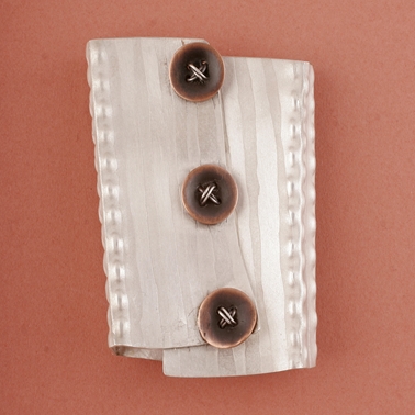 School blouse brooch, front view.