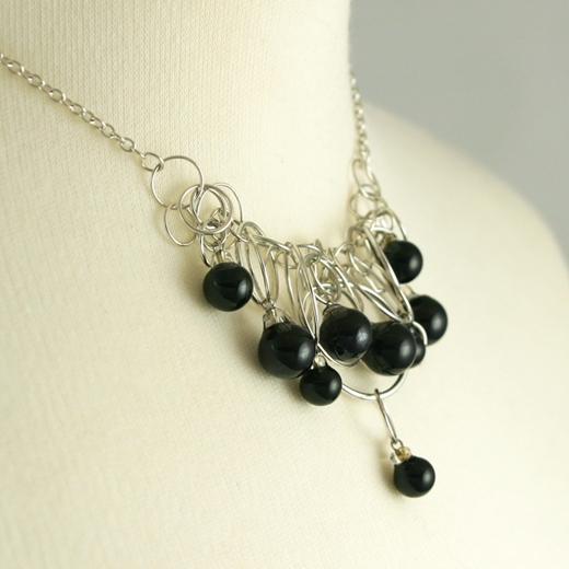 Solid Black 9 Bubble Necklace on model side